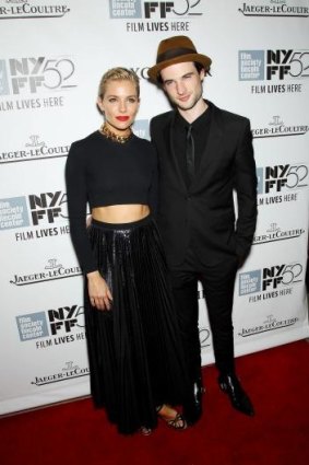 Clothes horse: Sienna Miller, left, and Tom Sturridge arrive at the 52nd New York Film Festival premiere of <i>Foxcatcher</i> at Alice Tully Hall in New York.