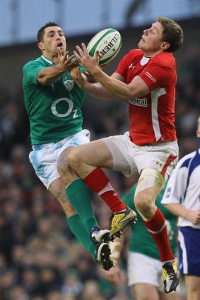 Rob Kearney of Ireland and Rhys Priestland of Wales challenge for a high ball.