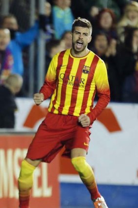 Barcelona's Gerard Pique celebrates scoring a goal.