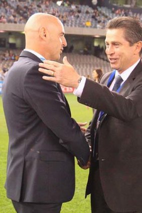 Victory coach Kevin Muscat and his Sydney FC counterpart Frank Farina shake hands before the A-League elimination final match on Friday.