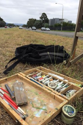 Canberra artist Christopher Oates' tools of his trade in his unusual workspace - the middle of Adelaide Avenue - on Wednesday.