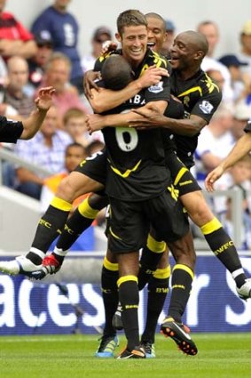 Finisher &#8230; Bolton's Gary Cahill is mobbed after scoring.