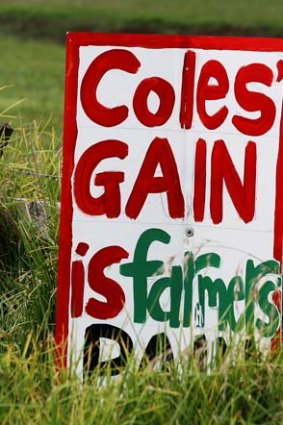 A sign on a dairy farm criticises Cole.
