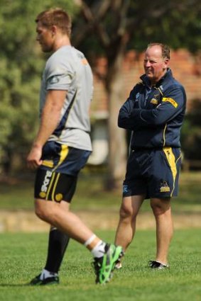 Coach Jake White watches the Brumbies train.