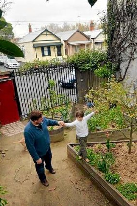 Collingwood homeowner Adam Cribbes, who will be affected by the East West tunnel on-ramp, with his son Dexter.