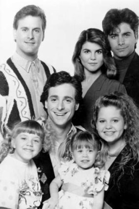The cast of <i>Full House</i> with one of the adorable Olsen twins (centre, front).