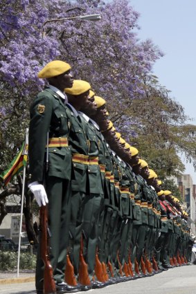 Members of the Presidential guard wait for Zimbabwean President Robert Mugabe to arrive for the opening of Parliament in Harare, Zimbabwe.