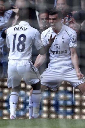 Tottenham Hotspur's Gareth Bale (right) celebrates with teammate Jermain Defoe after scoring against Manchester City.