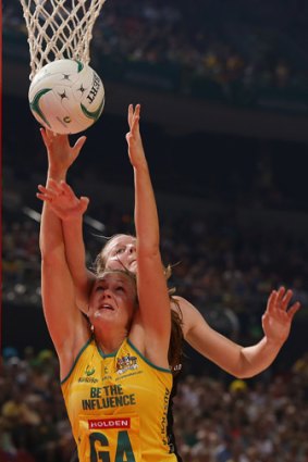 Australia’s Susan Pratley vies for the ball with Kiwi Katrina Grant.