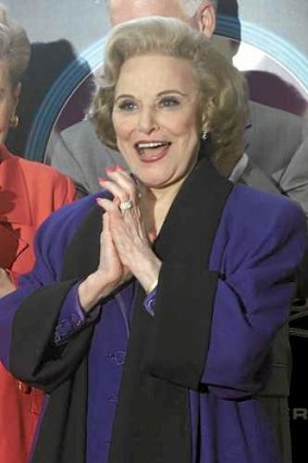 Pauline Phillips, also known as the advice columnist Dear Abby, applauds after her star on the Hollywood Walk of Fame is unveiled in 2001.