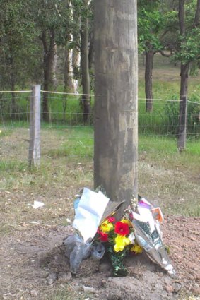 Tributes to the teens who died in the Anstead crash overnight are left in front of number 383 Hawkesbury Road.