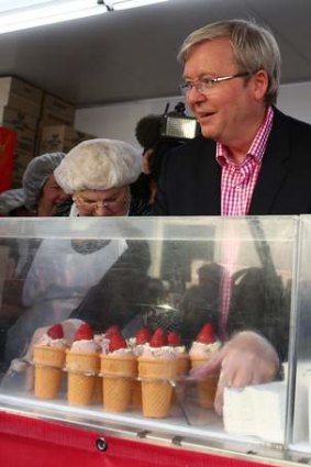 Up to old tricks?: Kevin Rudd serving a sundae on Ekka Wednesday.
