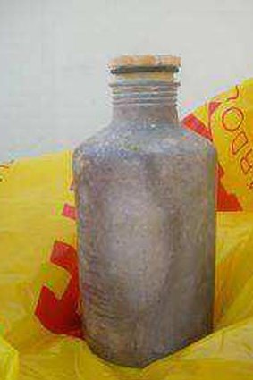 Silver canisters containing a toxic gas, like this one, are washing up on beaches in central Queensland.
