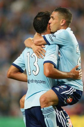 Ali Abbas and Tiago Calvano of Sydney FC celebrate.
