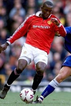 Stories to tell: Leicester City defender Robbie Savage closes in on Manchester United striker Dwight Yorke.