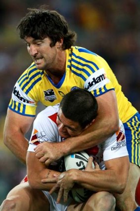 Still got it ... Bronx Goodwin is tackled by Nathan Hindmarsh.