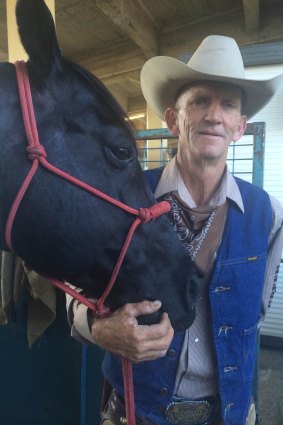 Animal trainer and trick rider Frank Green with Smokin' Jack at the Ekka.