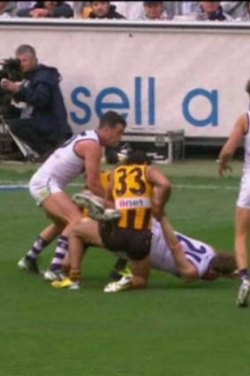 Hawthorn's Cyril Rioli faces match review panel scrutiny for this tackle.