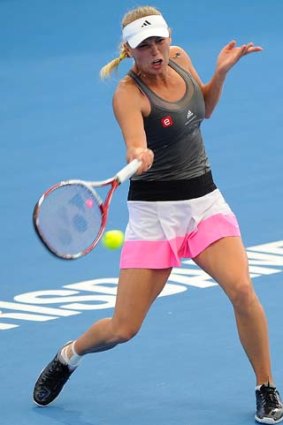 Caroline Wozniacki plays a forehand against Ksenia Pervak.