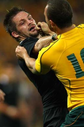 Feud brewing ... Richie McCaw tangles with Cooper in Brisbane before the 2011 World Cup.