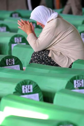 A Bosnian Muslim woman mourns by the coffin of a relative. <i>Picture: AFP/Elvis Barukcic</i>