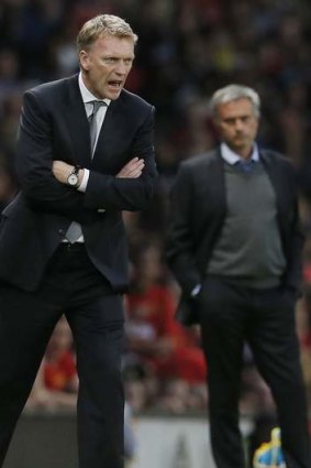 Management material: David Moyes, left, and Jose Mourinho at Old Trafford.