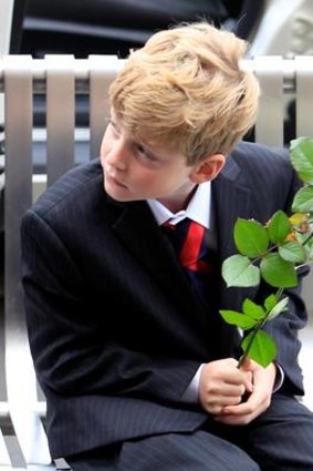 Son Tiernan with a white rose.