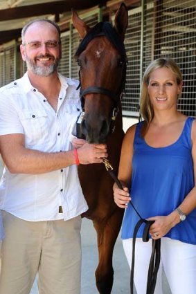 David Henderson poses for a photo with Zara Phillips at the Magic Millions Sales Complex on the Gold Coast on Wednesday. Phillips is the ambassador for the 2013 Magic Millions carnival.