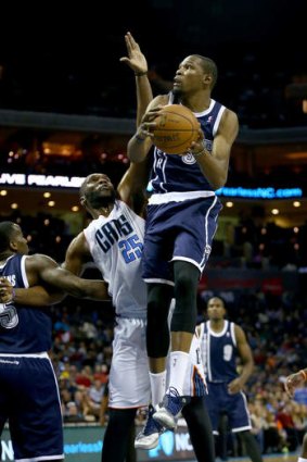 Oklahoma City Thunder forward Kevin Durant drives to the basket against Al Jefferson of the Charlotte Bobcats.