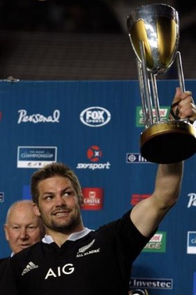 Wrapped up: New Zealand All Blacks captain Richie McCaw raises the Rugby Chapmpionship trophy.