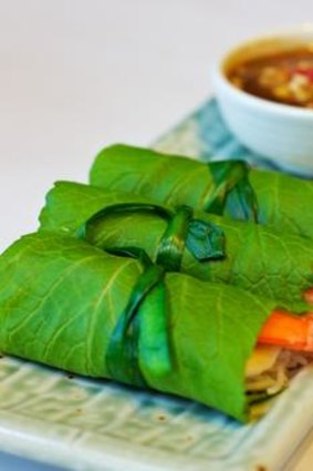 Fresh green mustard-leaf rolls with prawn, pork and rice noodles, and chicken liver dipping sauce.