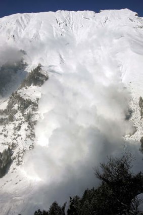 An avalanche sweeps downhill in the Vallee de la Sionne, Switzerland.