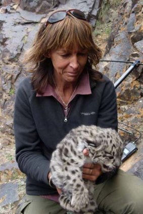 Life got even better &#8230; vet Carol Esson with a snow leopard cub in the Tost Mountains.