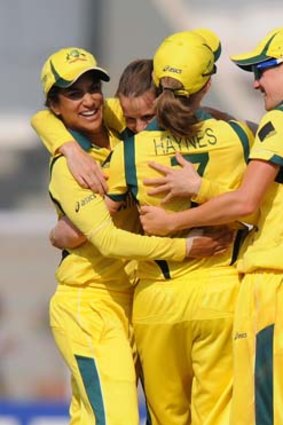 Cheers ... Erin Osborne and Lisa Sthalekar celebrate Australia's Super Sixes win over England on Friday.