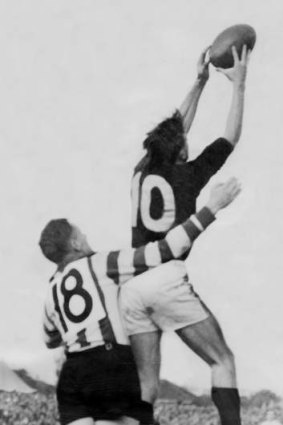 Footy in 1950: John Coleman takes a mark.