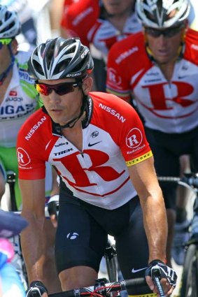 Robbie McEwen of Team Radio Shack competes ahead of Lance Armstrong.