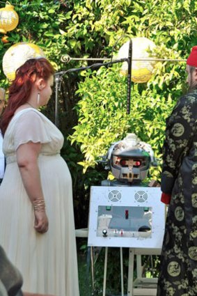A robot named Father Emiglio was at the wedding of Neva Reese and Moe McLendon.