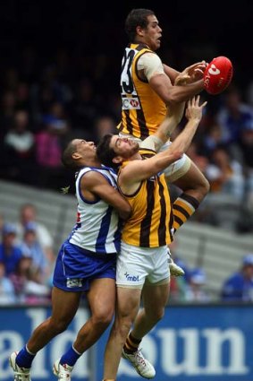 Hawthorn's Lance Franklin crashes into Tim Boyle while going for a mark against North Josh Gibson, April 5  2008.