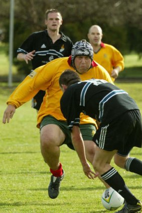 Got it covered: Shadow treasurer Joe Hockey during a politicians' rugby match in 2003.