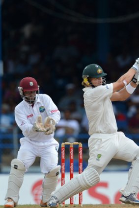 Hit out: Shane Watson smashes a four on his way to 56 runs in the second Test in Trinidad.