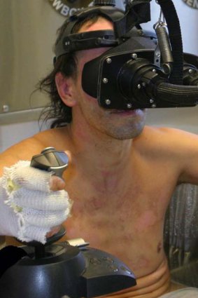 A burns patient plays SnowWorld, a virtual reality game set in the Arctic.