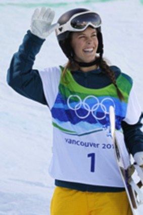 Torah Bright waves to the crowd after her qualifying run today.