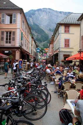 Rest point at at Bourg d'Oisans: Cyclists enjoying a rest before a steep climb in the French Alps.