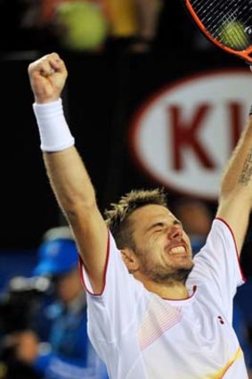 Pure bliss: Stanislas Wawrinka is ecstatic after defeating Novak Djokovic in a thrilling five-setter to enter the men's singles semi-finals on Tuesday.