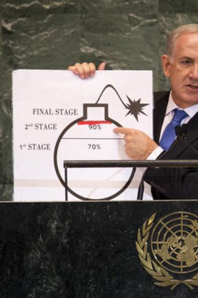 'Red line' ... Benjamin Netanyahu uses a diagram of a bomb to describe Iran's nuclear program to the UN  General Assembly meeting.