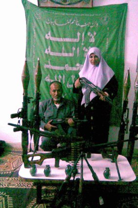 Betrayed ...  Mohammed Warshara  and his wife, proudly display weapons their son, Munir, smuggled into Gaza before his death.