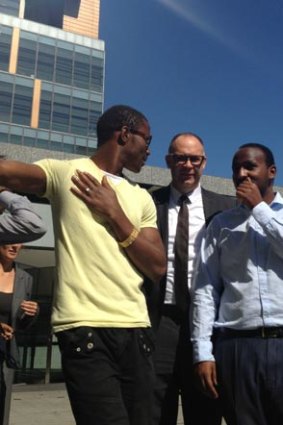 Peter Seidel, public interest partner at Arnold Bloch Leibler, which represented the men. Applicant Daniel Haile-Michael is in the blue shirt.