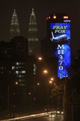 An illuminated office building in Kuala Lumpur.