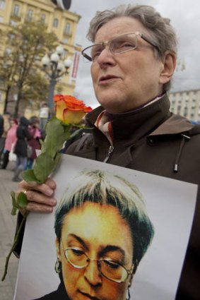 Remembrance ... The founder of the Russian rights group Memorial, Svetlana Gannushkina, holds a portrait of Anna Politkovskaya at the Moscow rally to mark the journalist's murder.