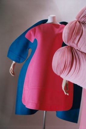 Comme des Garcon's flat suit (left) with a Valentino gown (right).  <i>Fashion Icons: Masterpieces from the collection of the Musee des Arts Decoratifs, Paris</i>, Art Gallery of South Australia, 